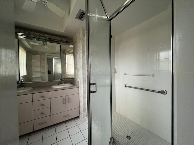 bathroom with an enclosed shower, vanity, tile patterned floors, and ceiling fan