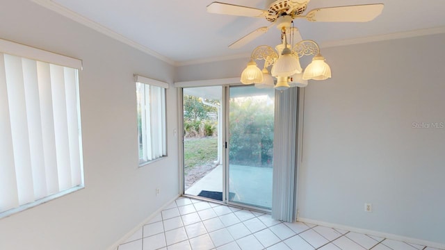 interior space with crown molding, ceiling fan, and light tile patterned flooring