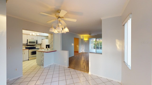 kitchen with crown molding, appliances with stainless steel finishes, white cabinetry, decorative backsplash, and kitchen peninsula