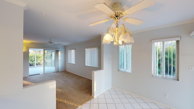 interior space featuring ornamental molding, a wealth of natural light, and ceiling fan