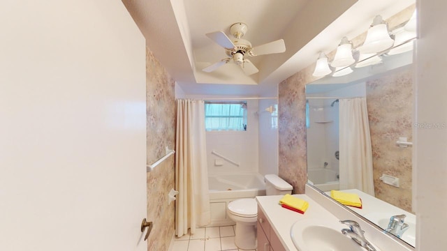 full bathroom with toilet, vanity, shower / bathtub combination with curtain, ceiling fan, and tile patterned flooring