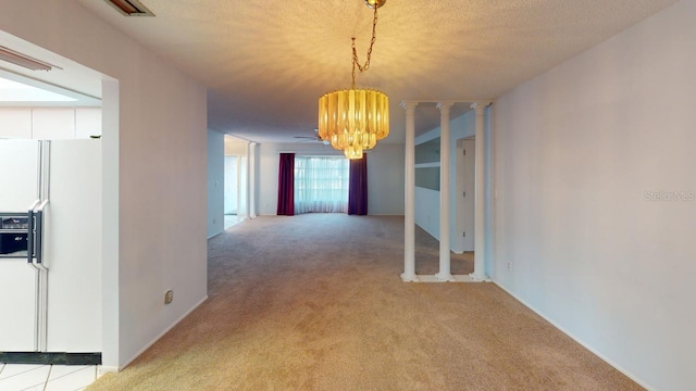 corridor featuring light carpet, a notable chandelier, and a textured ceiling