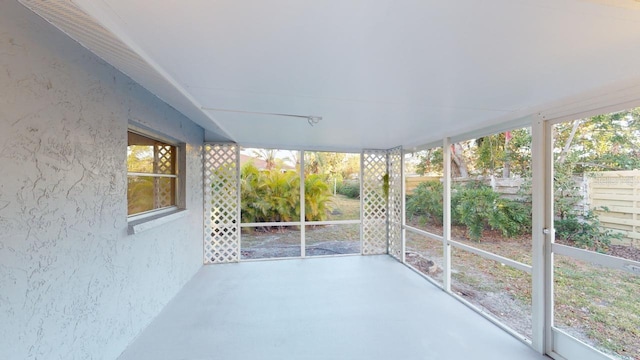 unfurnished sunroom featuring a wealth of natural light