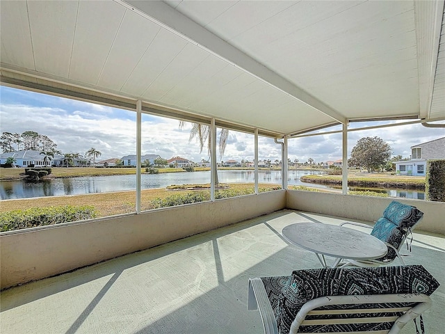 sunroom with a water view