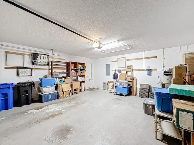 garage featuring a garage door opener and electric panel