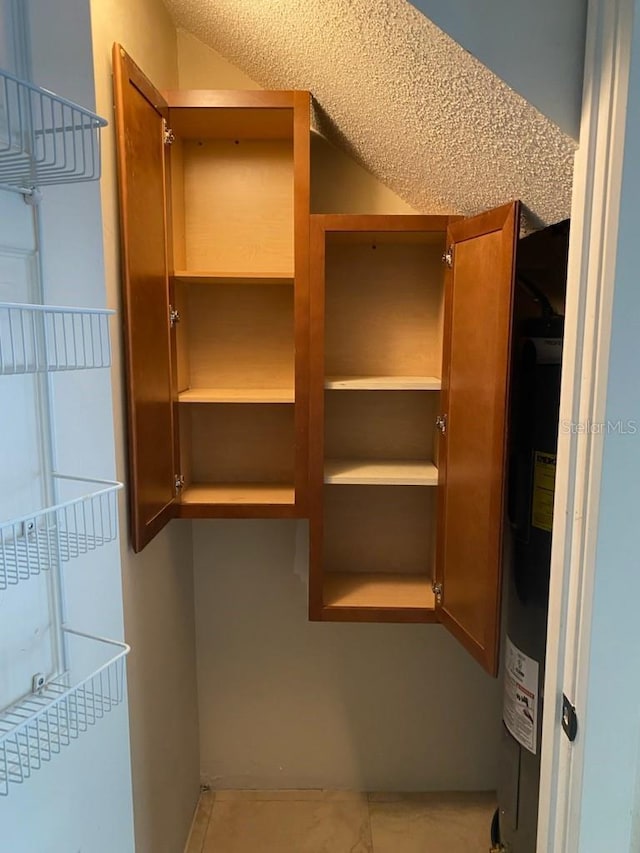 spacious closet featuring electric water heater