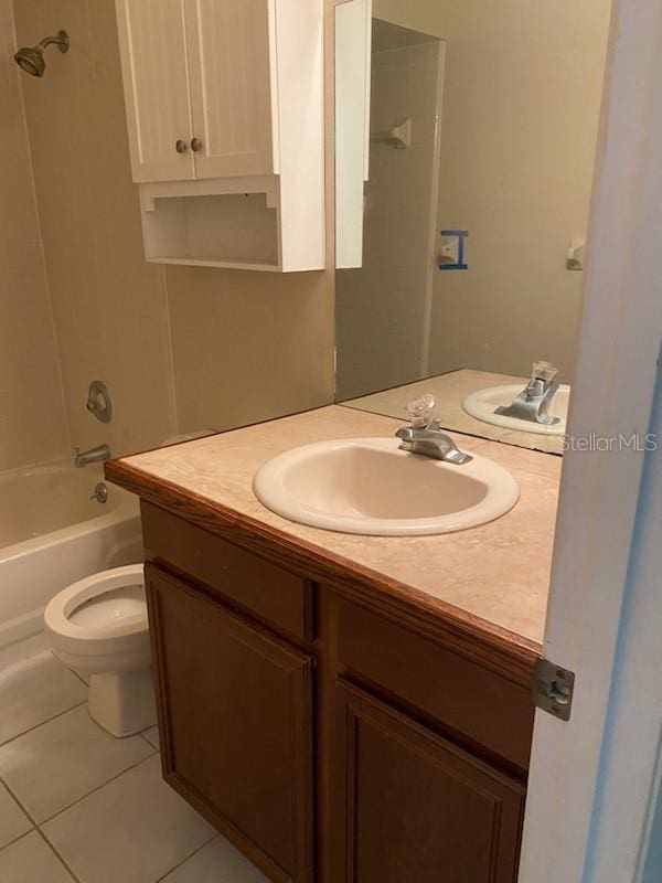 full bathroom with tile patterned flooring, vanity, tub / shower combination, and toilet