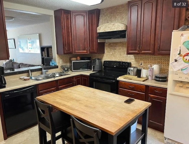 kitchen featuring sink, tasteful backsplash, black appliances, custom range hood, and a textured ceiling