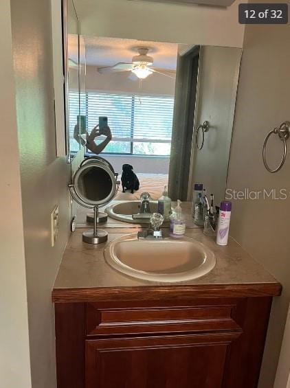 bathroom featuring vanity and ceiling fan