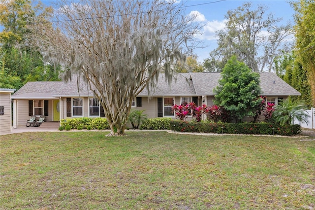 ranch-style house with a front lawn