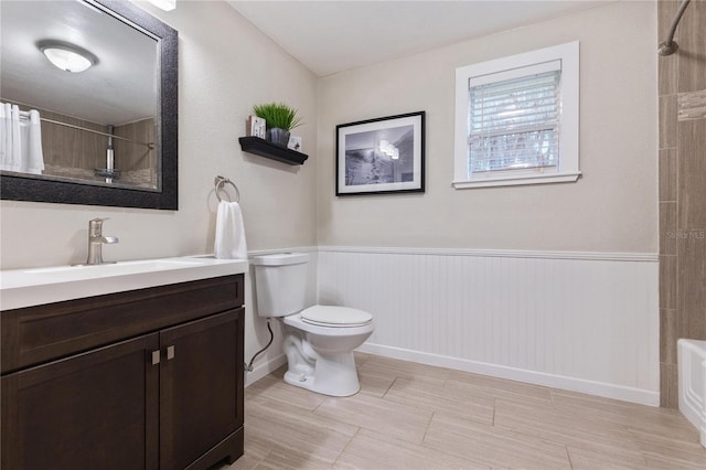 full bathroom with shower / tub combination, vanity, and toilet