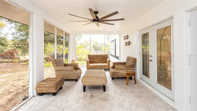 sunroom featuring french doors and ceiling fan