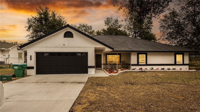 ranch-style house featuring a garage