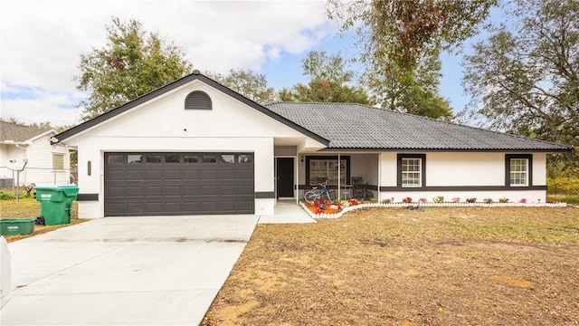 ranch-style home featuring a garage and a front yard