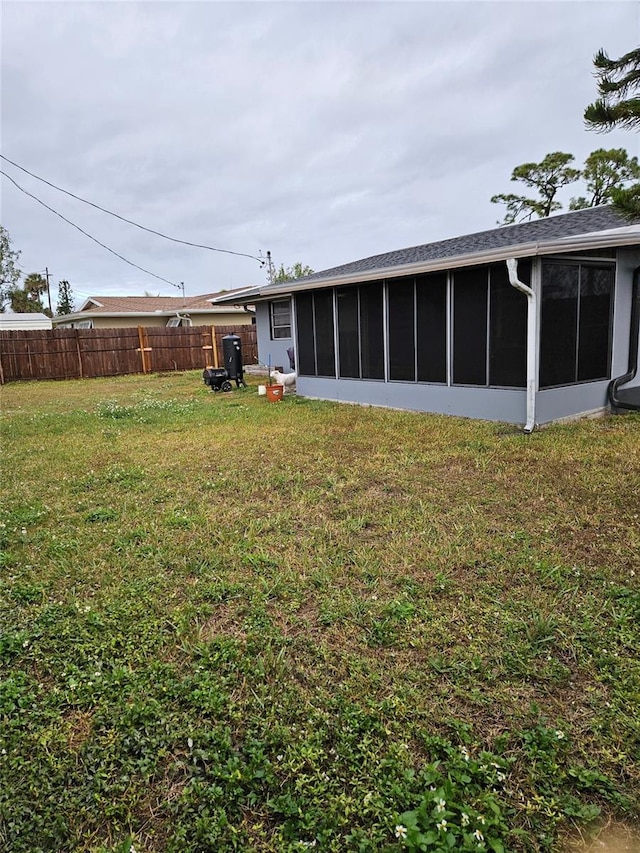 view of yard with a sunroom