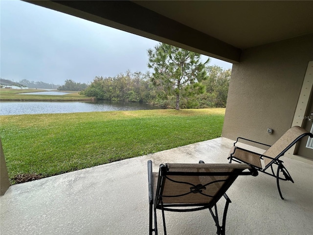 view of patio featuring a water view