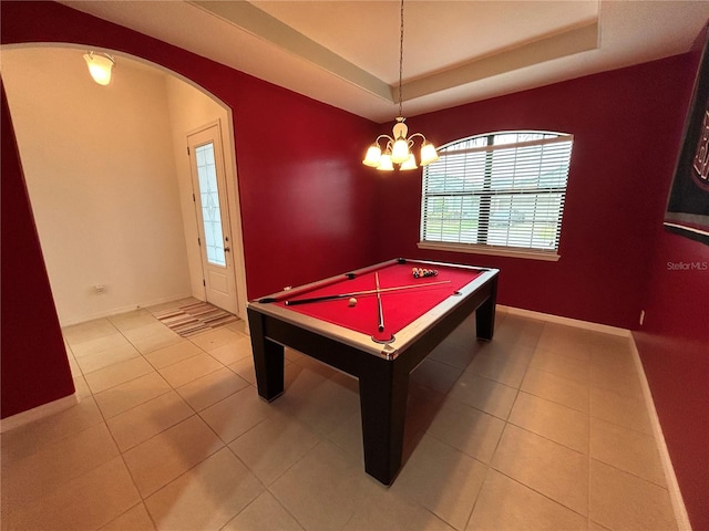 playroom featuring light tile patterned flooring, billiards, a tray ceiling, and an inviting chandelier