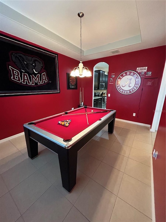 rec room with tile patterned flooring, pool table, and a raised ceiling