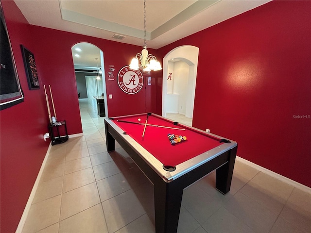 rec room with billiards, a raised ceiling, and light tile patterned floors