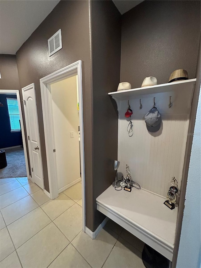 mudroom with light tile patterned floors