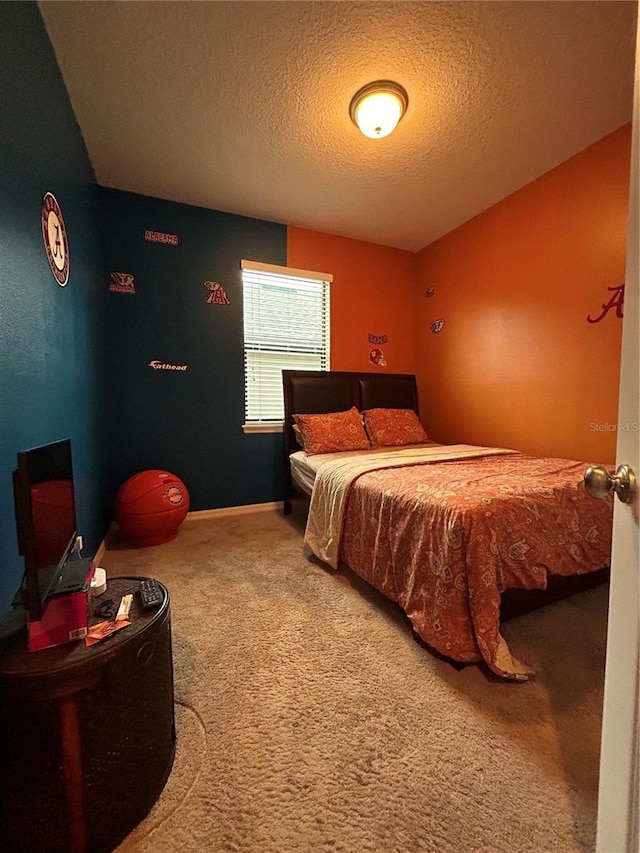 carpeted bedroom featuring a textured ceiling