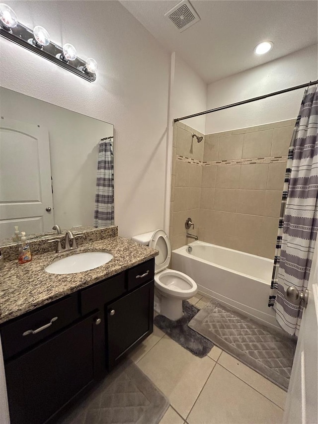 full bathroom with tile patterned flooring, vanity, shower / bath combination with curtain, and toilet