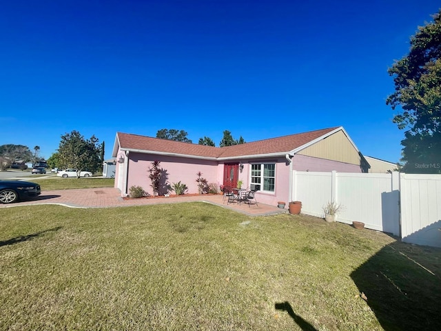 single story home featuring a patio and a front yard