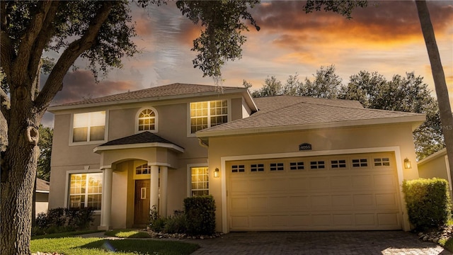 mediterranean / spanish house featuring a garage