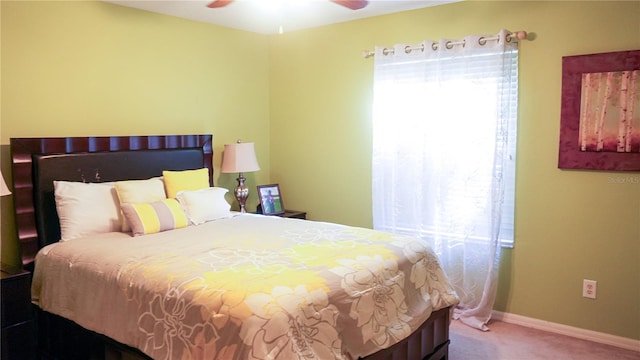 bedroom with multiple windows, carpet floors, and ceiling fan