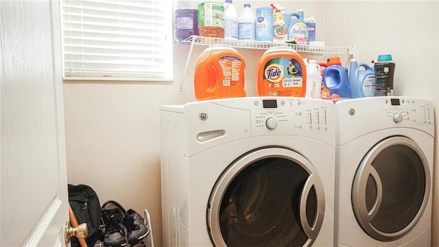 washroom with washing machine and dryer