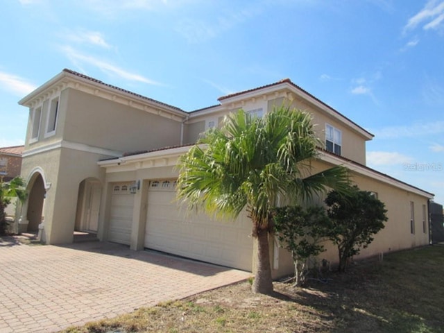 view of side of property with a garage