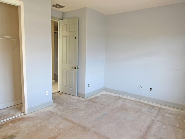 unfurnished bedroom with visible vents, baseboards, and a closet