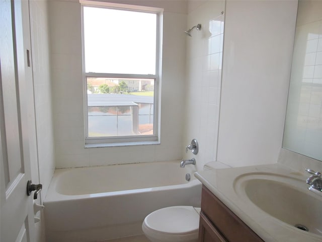 bathroom featuring toilet, shower / washtub combination, and vanity