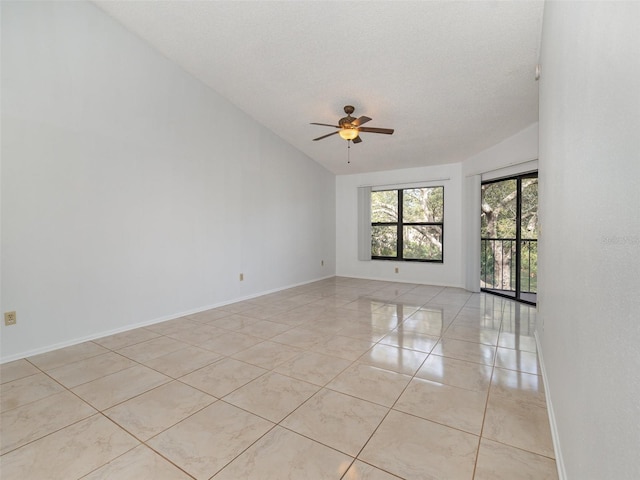 spare room featuring light tile patterned floors, a textured ceiling, vaulted ceiling, and ceiling fan