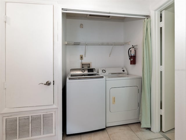 laundry area featuring independent washer and dryer