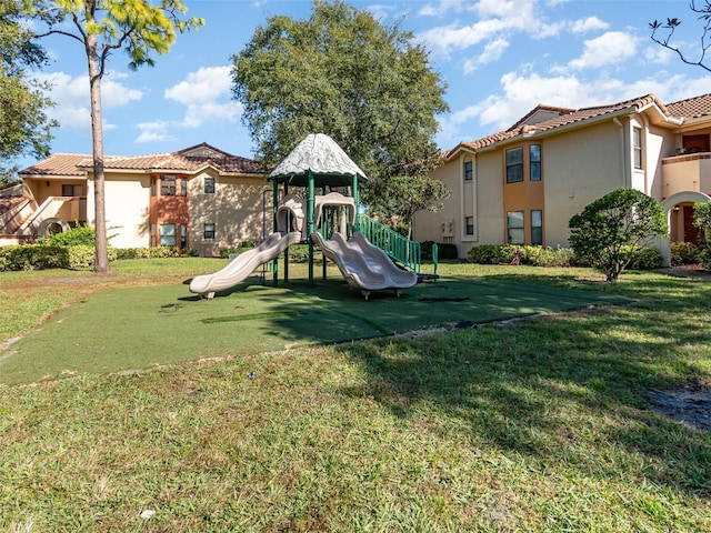 view of playground featuring a lawn