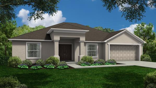 view of front of home featuring a garage and a front yard