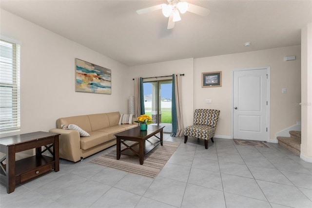 tiled living room featuring ceiling fan