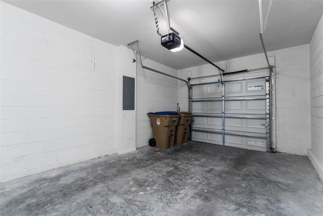 garage featuring a garage door opener and electric panel