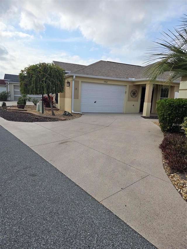 single story home with a garage