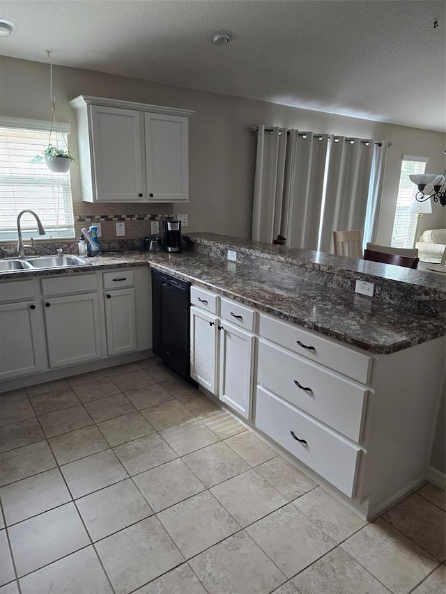 kitchen featuring white cabinetry, black dishwasher, sink, and pendant lighting