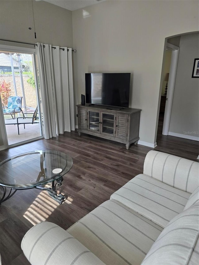 living room with dark hardwood / wood-style floors