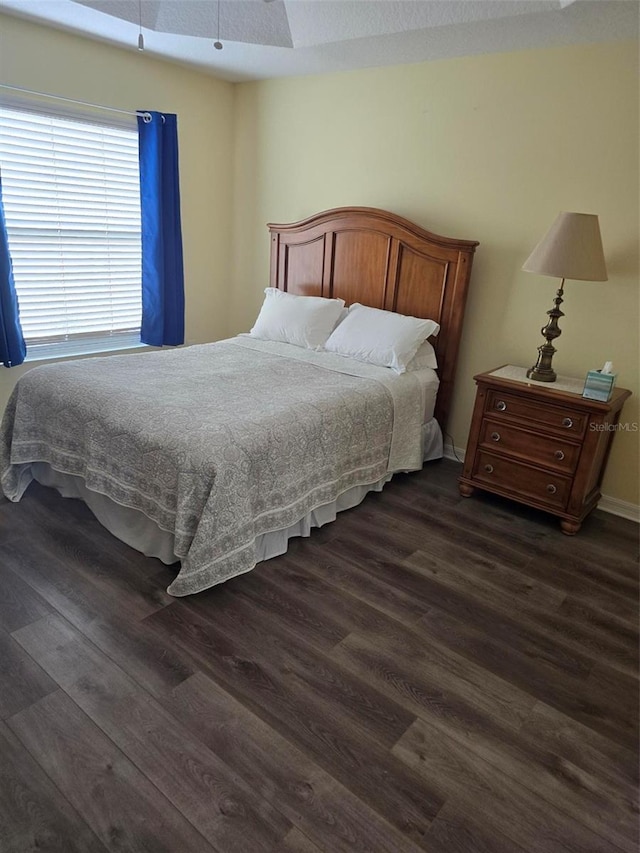 bedroom featuring dark hardwood / wood-style floors