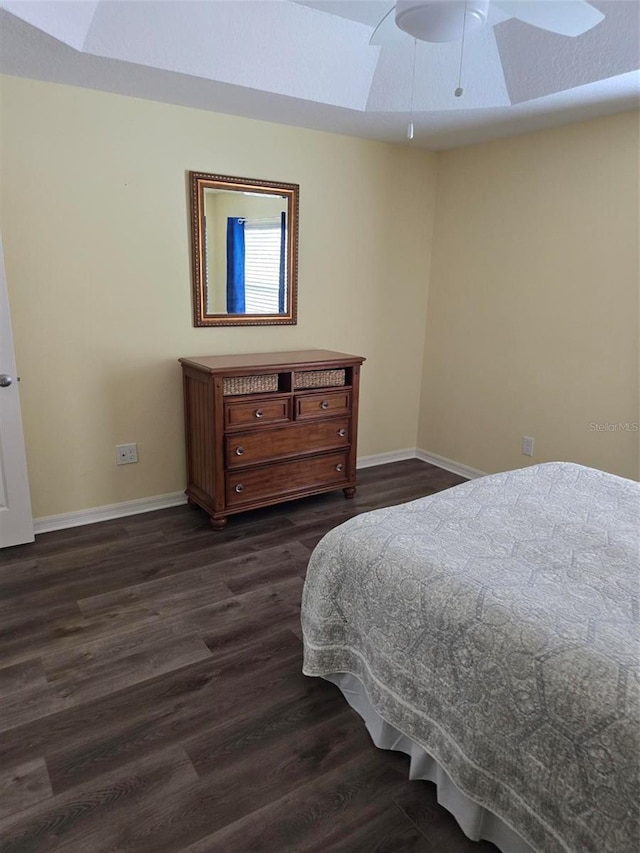 bedroom featuring dark wood-type flooring and ceiling fan