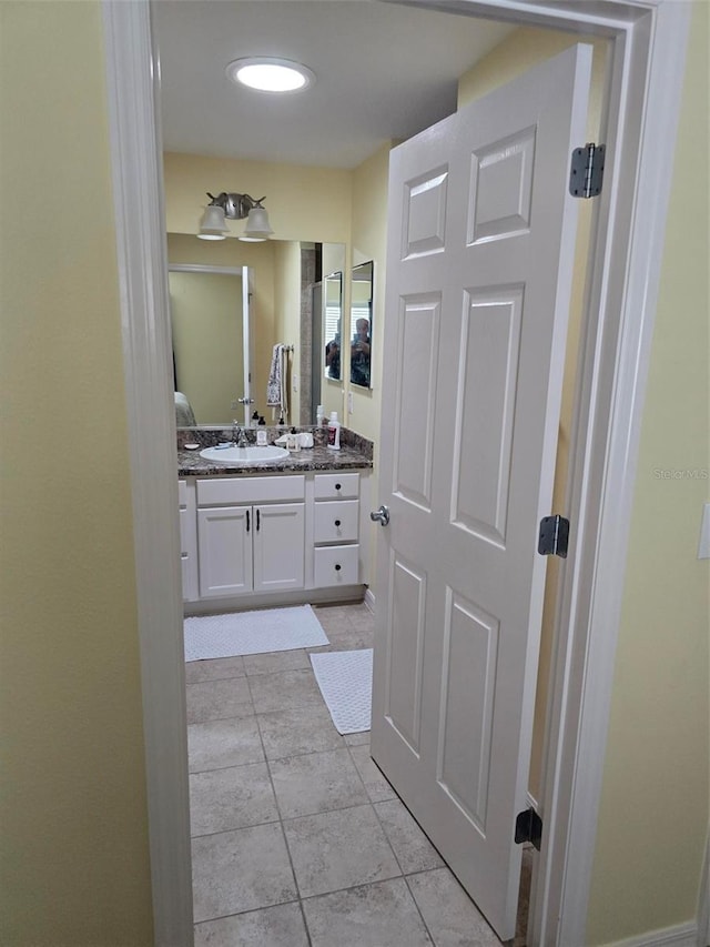 bathroom featuring vanity and tile patterned flooring