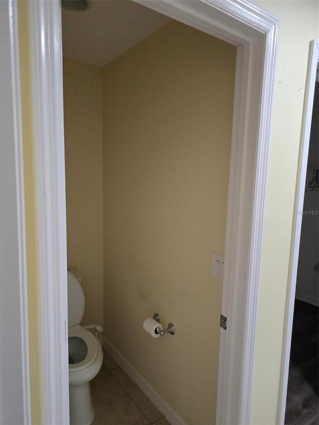 bathroom featuring tile patterned floors and toilet