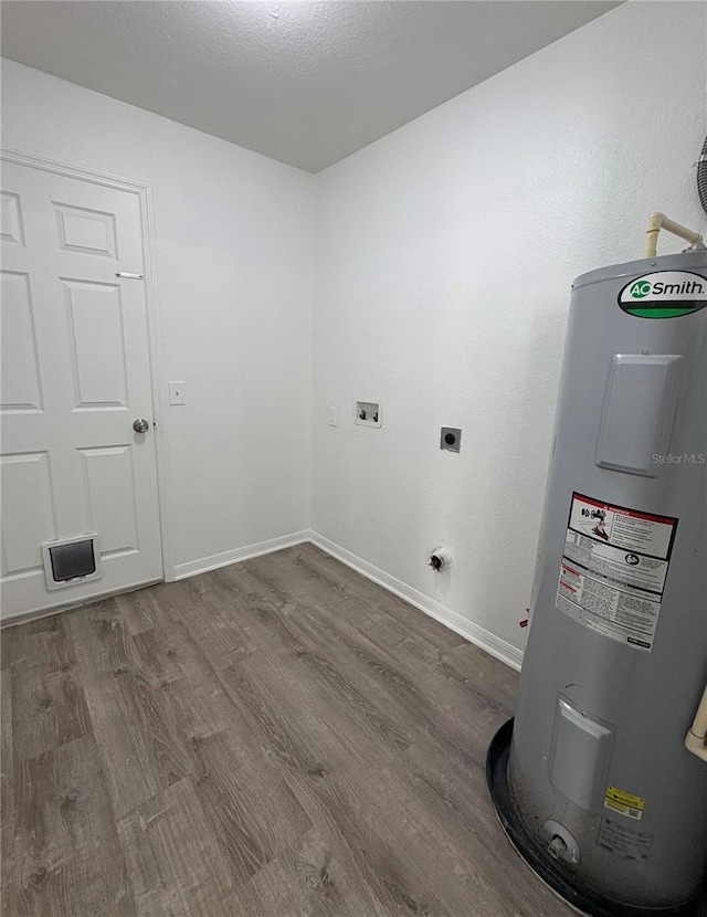 laundry room with washer hookup, wood-type flooring, water heater, and electric dryer hookup