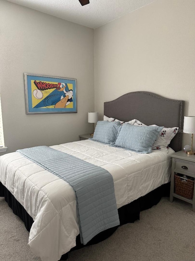 carpeted bedroom featuring a textured ceiling