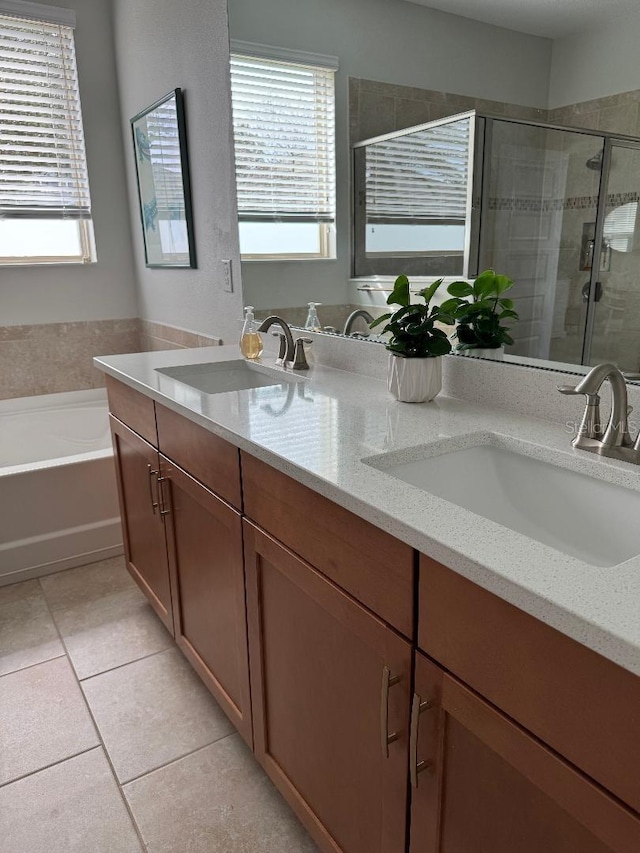 bathroom with vanity, tile patterned floors, plus walk in shower, and a healthy amount of sunlight