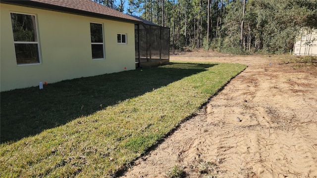 view of yard with a lanai